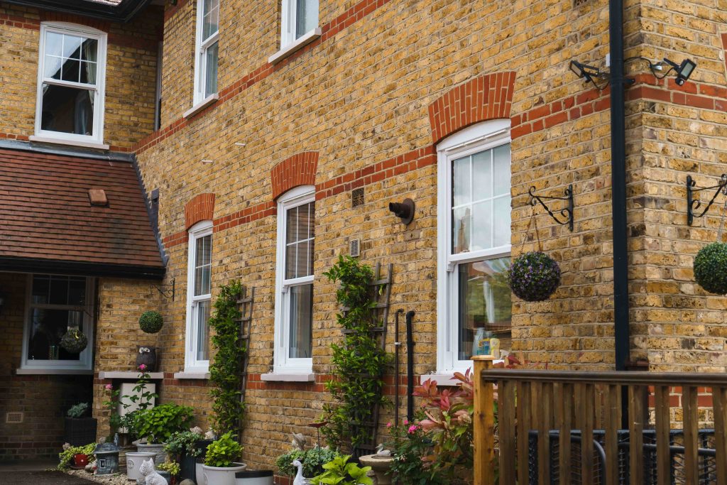 Modern or Traditional? How to Choose Windows That Match Your Home’s Architecture 2 ECOSlide vertical sliding windows sit proudly on a traditional property in Hornchurch, UK. These windows are white.